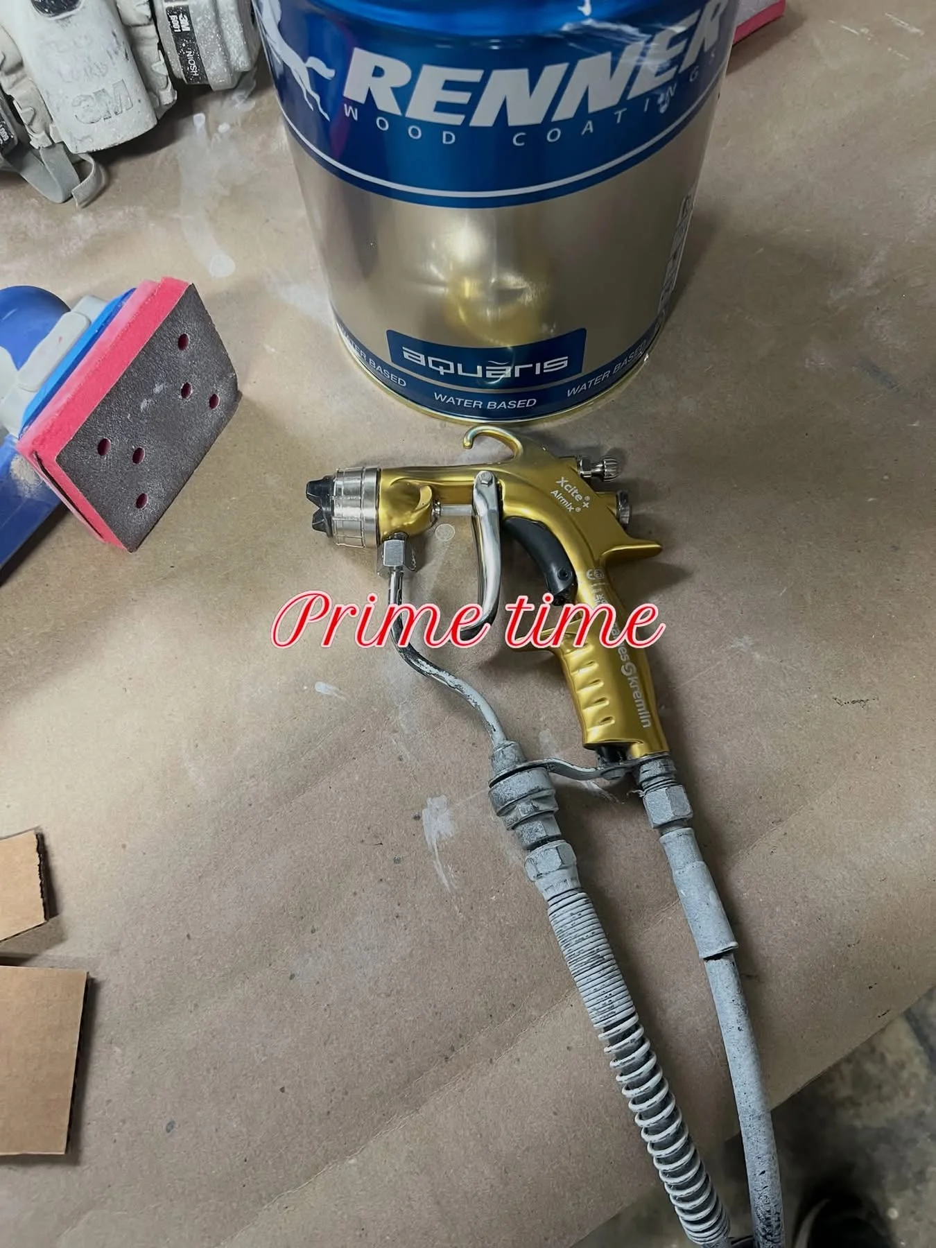 Professional spray gun and Renner wood coating used for cabinet refinishing